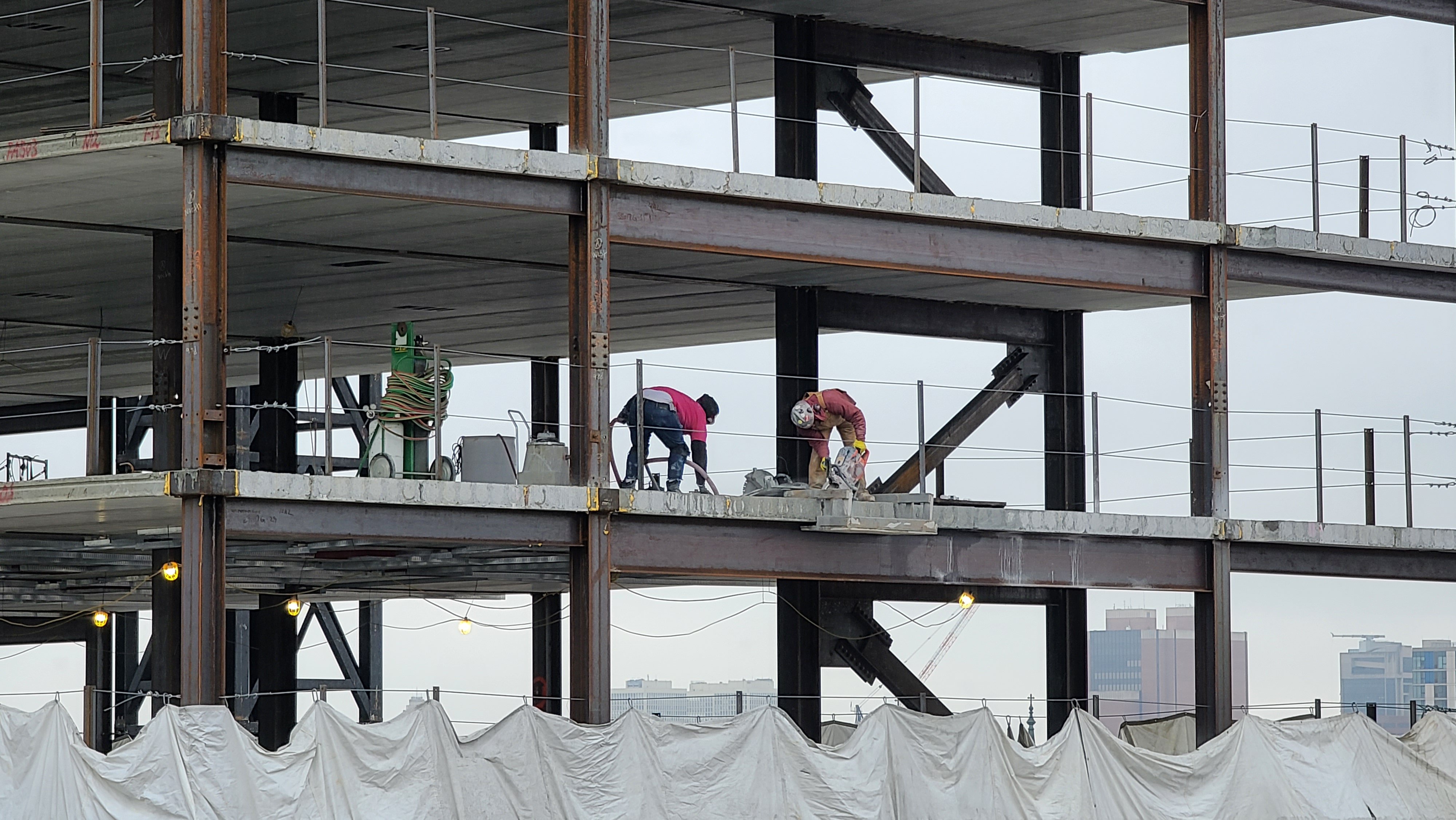 Workers on the 9th floor of the rising tower at 1300 Fairmount Ave.