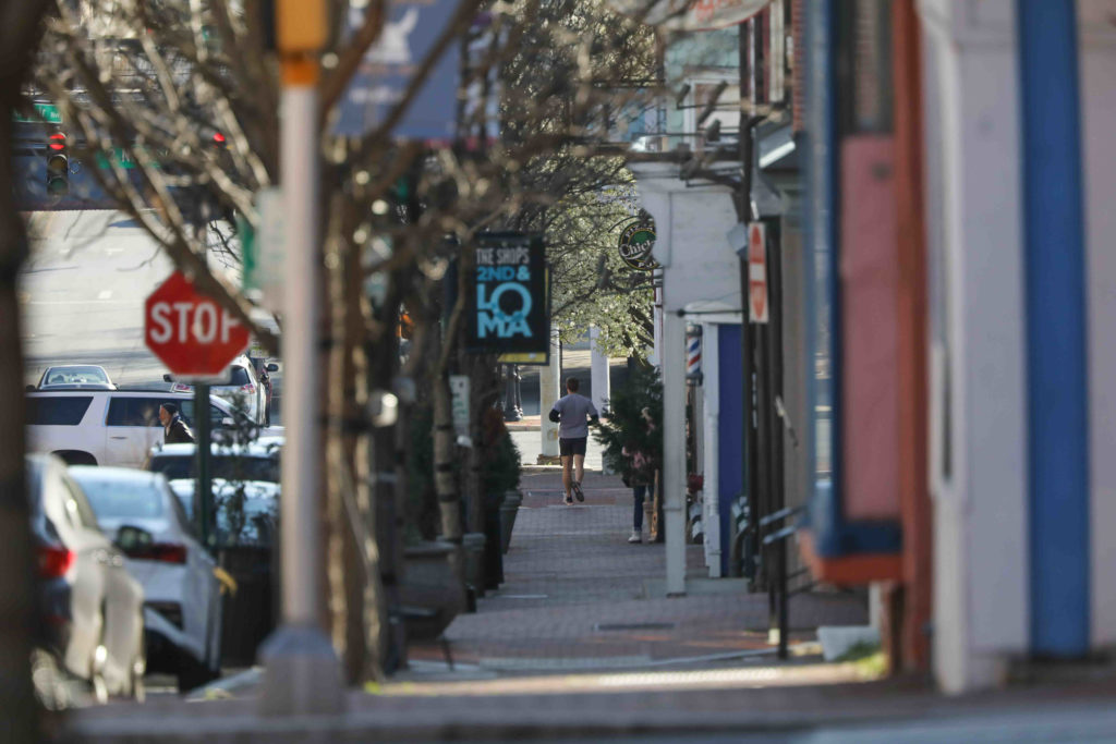 News 2020 – Mar 26 – Wilmington Delaware sees a reduction in activity due to the stay at home order. A jogger can be seen in the distance running in Wilmington