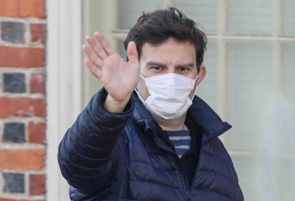 A man walks on Market Street in Wilmington, Del., wearing a protective mask Friday March 27, 2020. (Saquan Stimpson for WHYY)