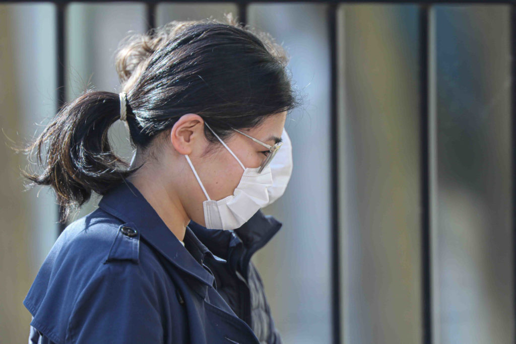 News 2020 – Mar 27 – Residents seen walking down Market Street with protective mask on their faces A woman walks in Wilmington, Del., wearing a protective mask