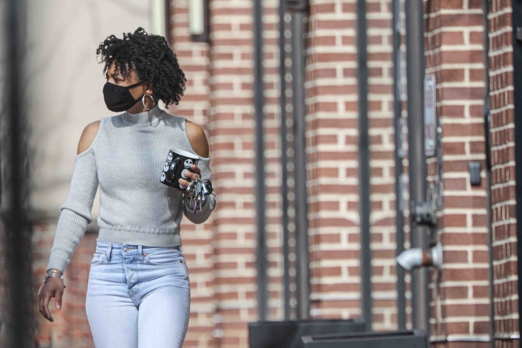News 2020 – Mar 27 – Residents seen walking down Market Street with protective mask on their faces Keona Berry walks down Market Street with a protective mask on her face on Friday, March 27, 2020, in Wilmington, Del. (Saquan Stimpson for WHYY)