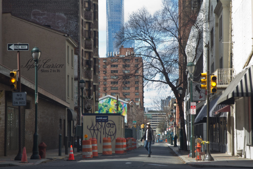 2020 3 24 k paynter streets during cornoavirus shutdowns-6 A person walks down Sansom Street in Center City Tuesday. (Kimberly Paynter/WHYY)