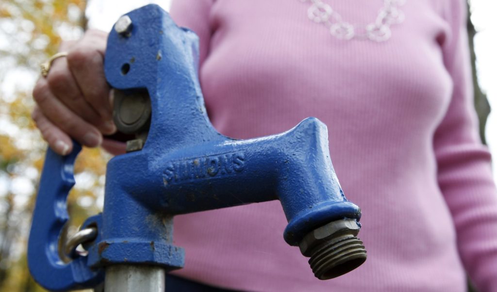 AP_111014132075-e1583162597374-1920×1128 a close-up of a tap for well water
