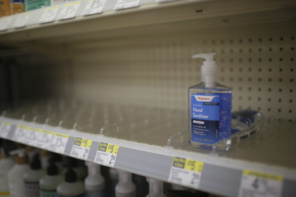 Virus Outbreak Hand Sanitizer Shortage In this Feb. 28, 2020 file photo, rows of hand sanitizer are seen empty at a Walgreens in Idaho Falls, Idaho. Fear of the coronavirus has led people to stock up on hand sanitizer, leaving store shelves empty and online retailers with sky-high prices set by those trying to profit on the rush. (John Roark/The Idaho Post-Register via AP, file)