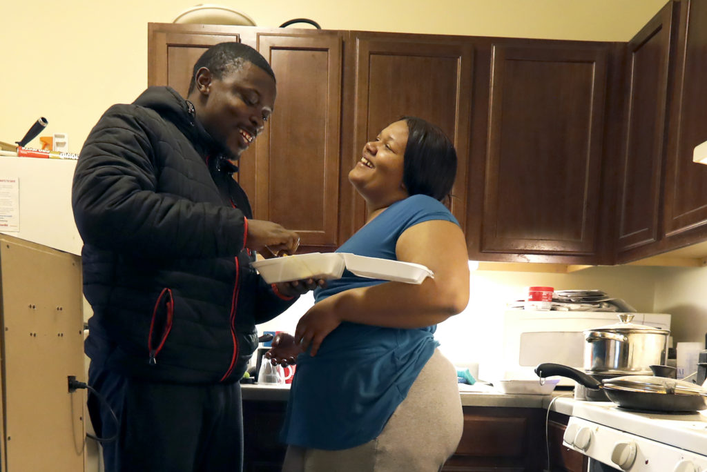 Food Stamps In this Thursday, Feb. 27, 2020, photo, Richard Butler and his fiancé Amber laugh while they have breakfast in an apartment a friend is letting them live in on Chicago’s Southside. (Charles Rex Arbogast/AP Photo)