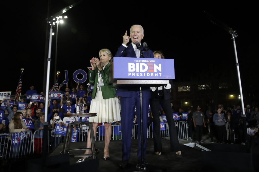Joe Biden Democratic presidential candidate former Vice President Joe Biden speaks, next to his wife Jill during a primary election night rally Tuesday, March 3, 2020, in Los Angeles. (AP Photo/Marcio Jose Sanchez)