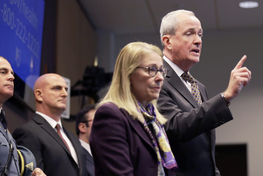 Phil Murphy FILE- In this March 2, 2020 file photo, New Jersey Gov. Phil Murphy, right, is joined by Health Commissioner Judith Persichilli, center, during a news conference in Ewing, N.J., Monday, March 2, 2020. On Wednesday, March 4, 2020, Murphy, Persichilli and Acting Governor Sheila Oliver announced the first presumptive positive case of novel coronavirus, or COVID-19, in New Jersey. The individual, a male in his 30s, is hospitalized in Bergen County and has been hospitalized since March 3. (AP Photo/Seth Wenig, File)
