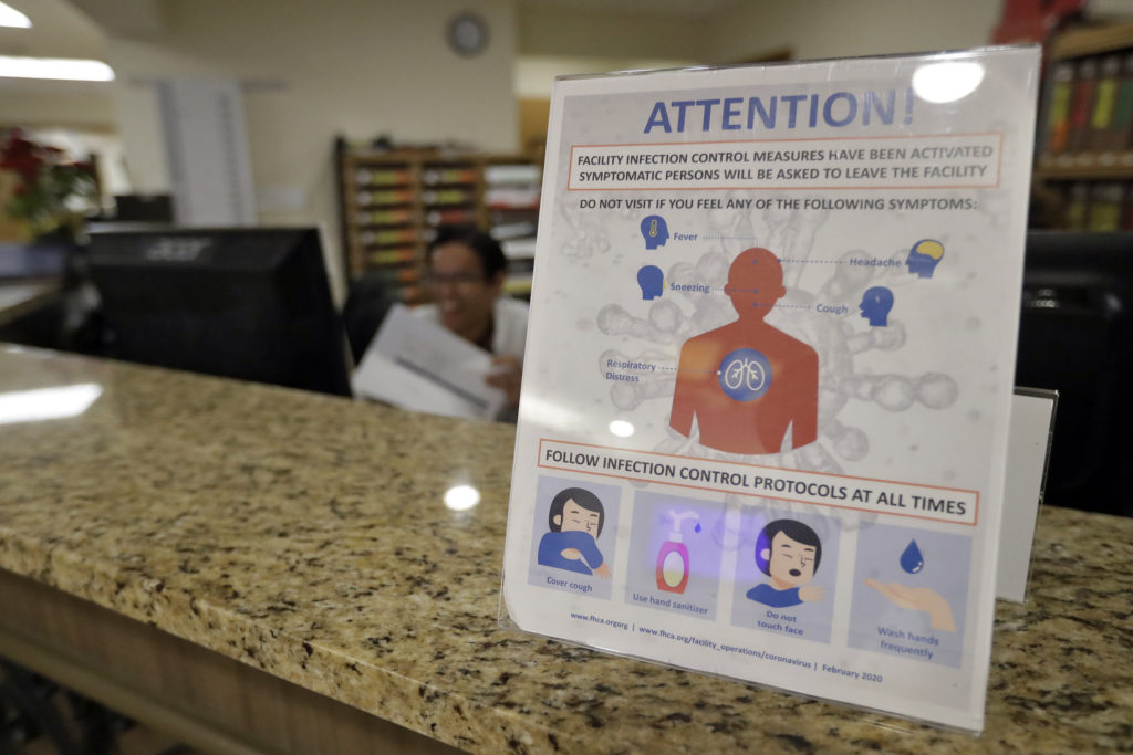 Virus Outbreak Nursing Homes An infection Control Protocol poster sits on a nursing station desk at the Palm Garden of Tampa Health and Rehabilitation Center Thursday, March 5, 2020, in Tampa, Fla. (Chris O'Meara/AP Photo)