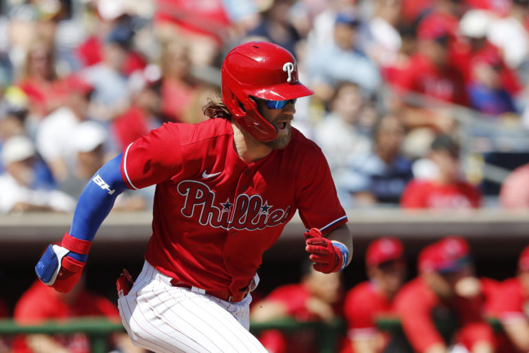 Philadelphia Phillies' Bryce Harper runs to first during a spring training baseball game against the New York Yankees, Monday, March 9, 2020, in Clearwater, Fla. (AP Photo/Carlos Osorio)
