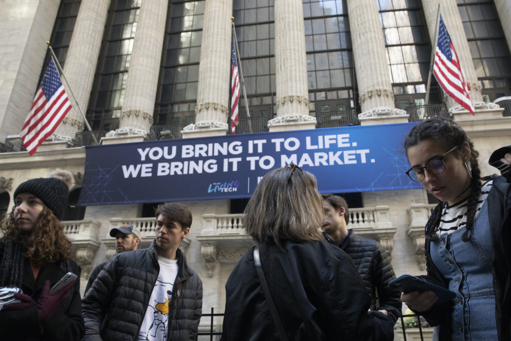 Financial Markets In this Monday, March 9, 2020 file photo, people stop to look at the New York Stock Exchange. Stocks are opening sharply lower on Wall Street Wednesday as fears of economic fallout from the coronavirus outbreak grip markets again. (Mark Lennihan/AP Photo)