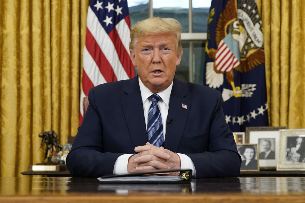 APTOPIX Trump Virus Outbreak President Donald Trump speaks in an address to the nation from the Oval Office at the White House about the coronavirus Wednesday, March, 11, 2020, in Washington. (Doug Mills/The New York Times via AP, Pool)