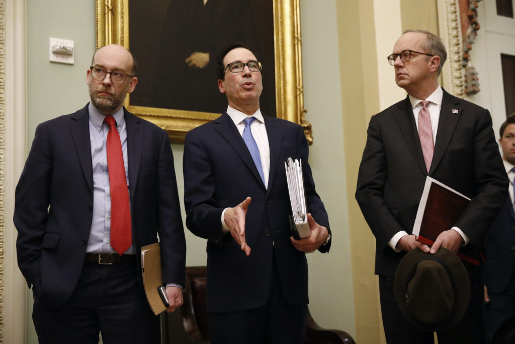 Steve Mnuchin Treasury Secretary Steve Mnuchin, center, speaks with members of the media as he departs a meeting with Senate Republicans on an economic lifeline for Americans affected by the coronavirus outbreak. on Capitol Hill in Washington, Monday, March 16, 2020. (Patrick Semansky/AP Photo)