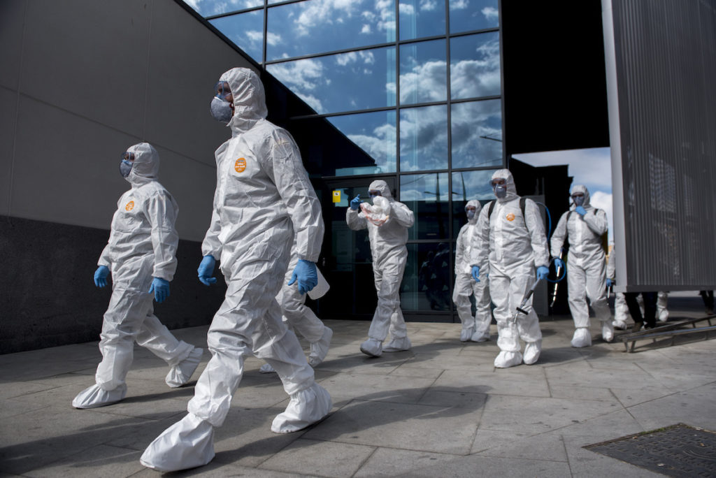 APTOPIX Spain Virus Outbreak The UME (Emergency Army Unit) attend the train station in Granada, Spain Tuesday March 17, 2020. Police checked passports and IDs at the Pyrenees' border with France and along the 1,200 kilometer shared border with Portugal, as Spain re-established controls for incoming and outgoing travellers to stem the new COVID-19 coronavirus outbreak. For most people, the new coronavirus causes only mild or moderate symptoms. For some, it can cause more severe illness, especially in older adults and people with existing health problems. (AP Photo/Carlos Gil)