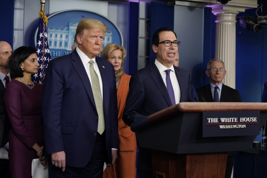 Treasury Secretary Steven Mnuchin speaks during a press briefing with the coronavirus task force, at the White House, Tuesday, March 17, 2020, in Washington, as President Donald Trump looks on. (Evan Vucci/AP Photo)