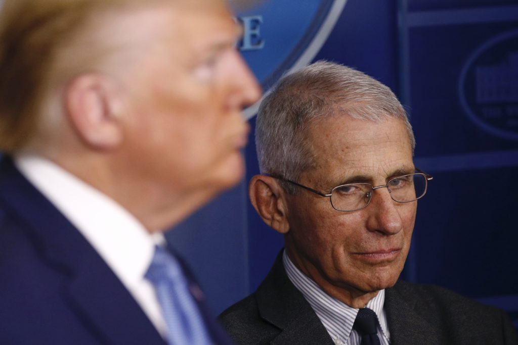 Donald Trump, Anthony Fauci Director of the National Institute of Allergy and Infectious Diseases Dr. Anthony Fauci, right, and President Donald Trump listen as Vice President Mike Pence speaks during a coronavirus task force briefing at the White House, Saturday, March 21, 2020, in Washington. (AP Photo/Patrick Semansky)
