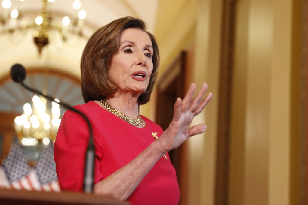 Virus Outbreak Congress House Speaker Nancy Pelosi of Calif. speaks outside her office on Capitol Hill, Monday, March 23, 2020. (AP Photo/Andrew Harnik, Pool)