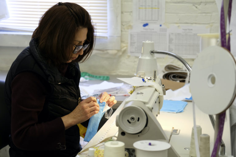 Seamstress Adita Rodriguez sews a surgical mask at Sareh Nouri's atelier in Rutherford, N.J., Wednesday, March 25, 2020. (Seth Wenig/AP Photo)