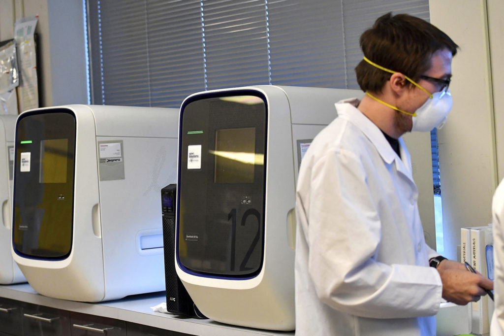 Virus Outbreak Pennsylvania Testing Molecular technologists work next to QuantStudio 12K Flex Real Time PCR machines that test for COVID-19 at MHS Labs, Friday, March 27, 2020, in Monroeville, Pa. (Matt Freed/Pittsburgh Post-Gazette via AP)