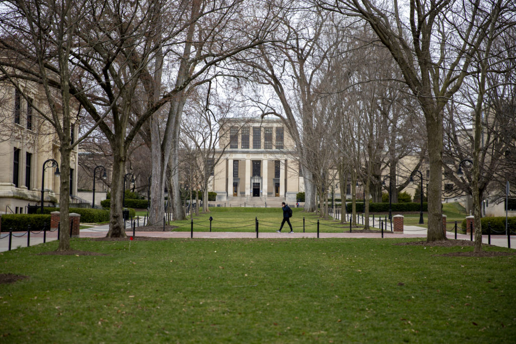 IMG_6227 A student walks alone at Penn State’s University Park campus, where coronavirus has suspended in-person classes. (Min Xian / WPSU)