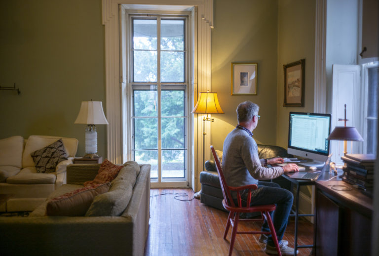 Michael Prell, who works in IT, working from home in his living room (Jessica Kourkounis for Keystone Crossroads)