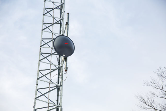 This specific receiver mounted on the radio tower points at another radio dish at Allensville, where a nearby fibre optic network turns into radio signal. (Min Xian/Keystone Crossroads)