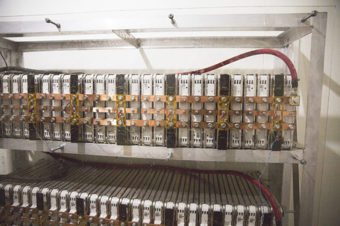 These batteries are stored in the equipment room and power the mountaintop setup. (Min Xian/Keystone Crossroads)