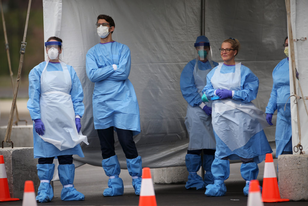 SOUTHPHILLY21-ll Medical workers wait for cars to pull up to the swabbing tent at the city's coronavirus testing site next to Citizens Bank Park in South Philadelphia on Friday, March 20, 2020. (The Philadelphia Inquirer)