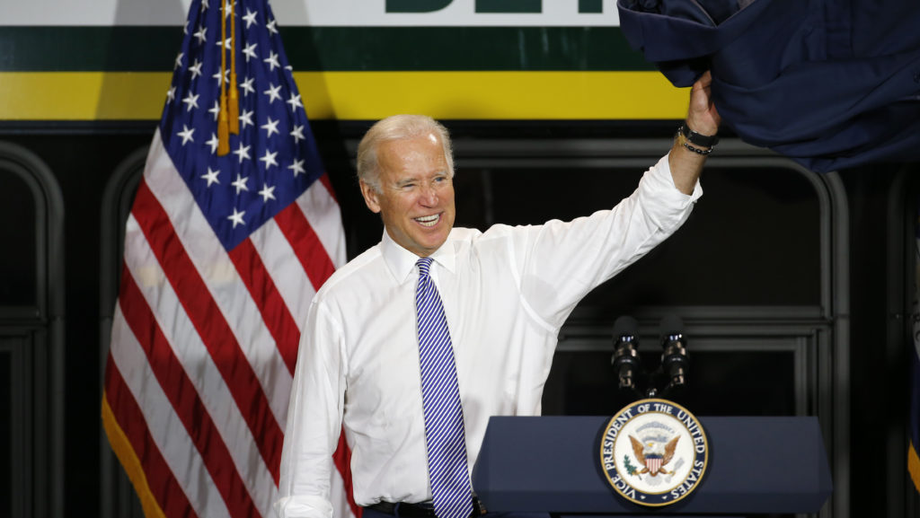 Vice President Joe Biden waves after speaking in Detroit in September 2015. Then-Vice President Joe Biden exits after touring a new bus in Detroit in September 2015. (Paul Sancya/AP Photo)