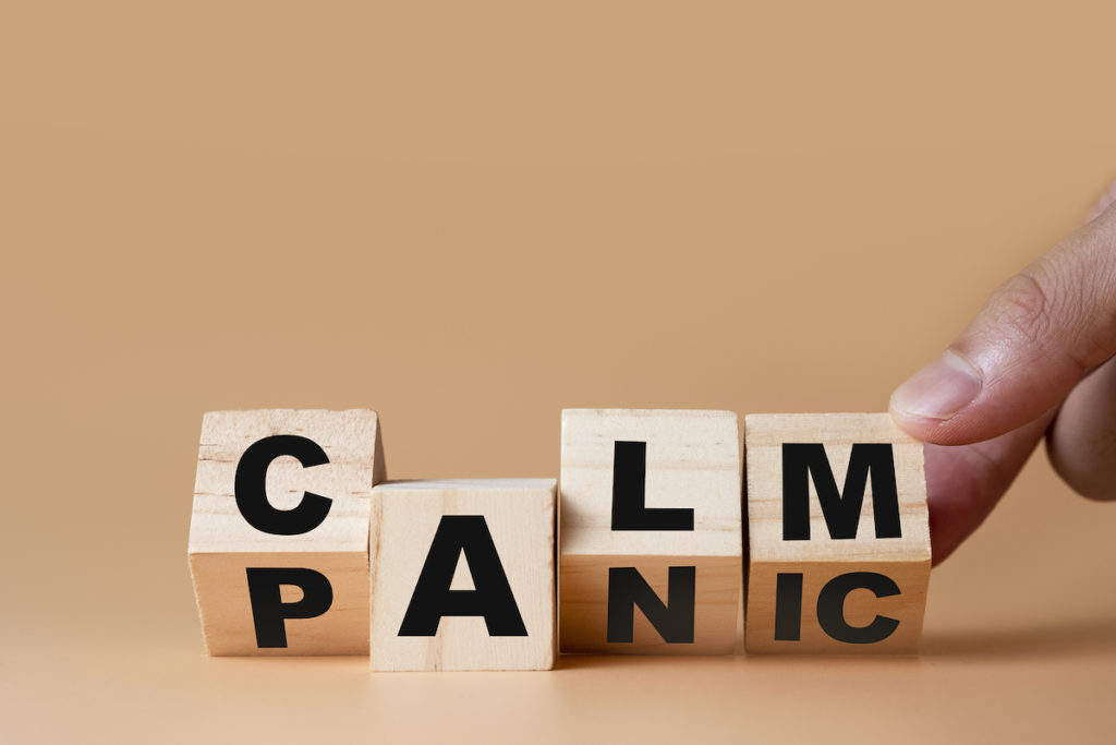 Hand Flipping Wooden Cubes For Change Wording” Panic ” To ” Calm”. Mindset Is Important For Human Bigstock/Dilok