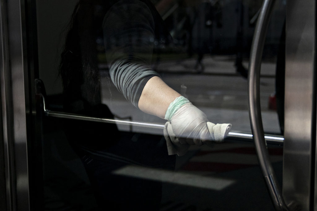 When an infected person touches a surface, like a door handle, there’s a risk they leave viruses stuck there that can live on for two to three days. When an infected person touches a surface, like a door handle, there's a risk they leave viruses stuck there that can live on for two to three days. (Andrew Harrer/Bloomberg via Getty Images)