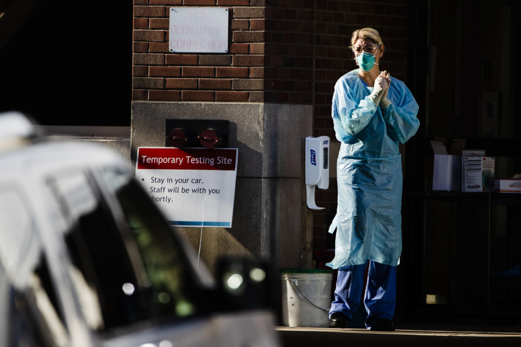 Virus Outbreak Pennsylvania A health care worker stands by at a COVID-19 temporary testing site at Abington Hospital in Abington, Pa., Wednesday, March 18, 2020. (Matt Rourke/AP Photo)