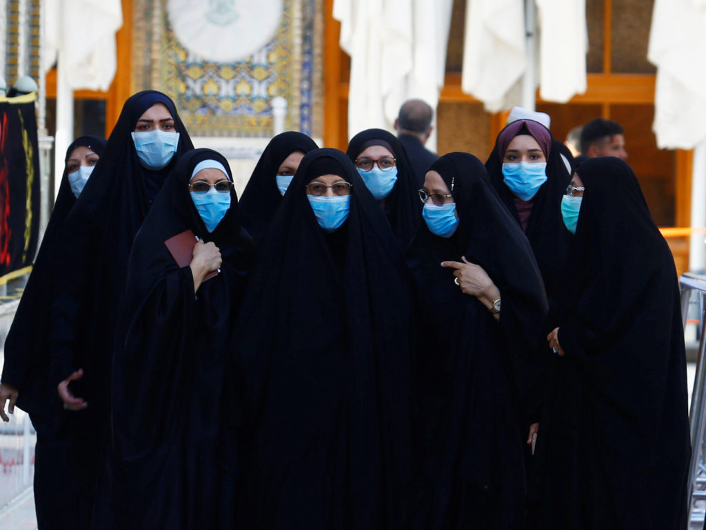 With the coronavirus spreading in dozens of countries, the World Health Organization officially declared the COVID-19 viral disease a pandemic Wednesday. Here, Muslim women wear protective face masks at the Imam Ali Shrine following an outbreak of the coronavirus in the city of Najaf, Iraq. With the coronavirus spreading in dozens of countries, the World Health Organization officially declared the COVID-19 viral disease a pandemic Wednesday. Here, Muslim women wear protective face masks at the Imam Ali Shrine following an outbreak of the coronavirus in the city of Najaf, Iraq. (Alaa Al-Marjani/Reuters)