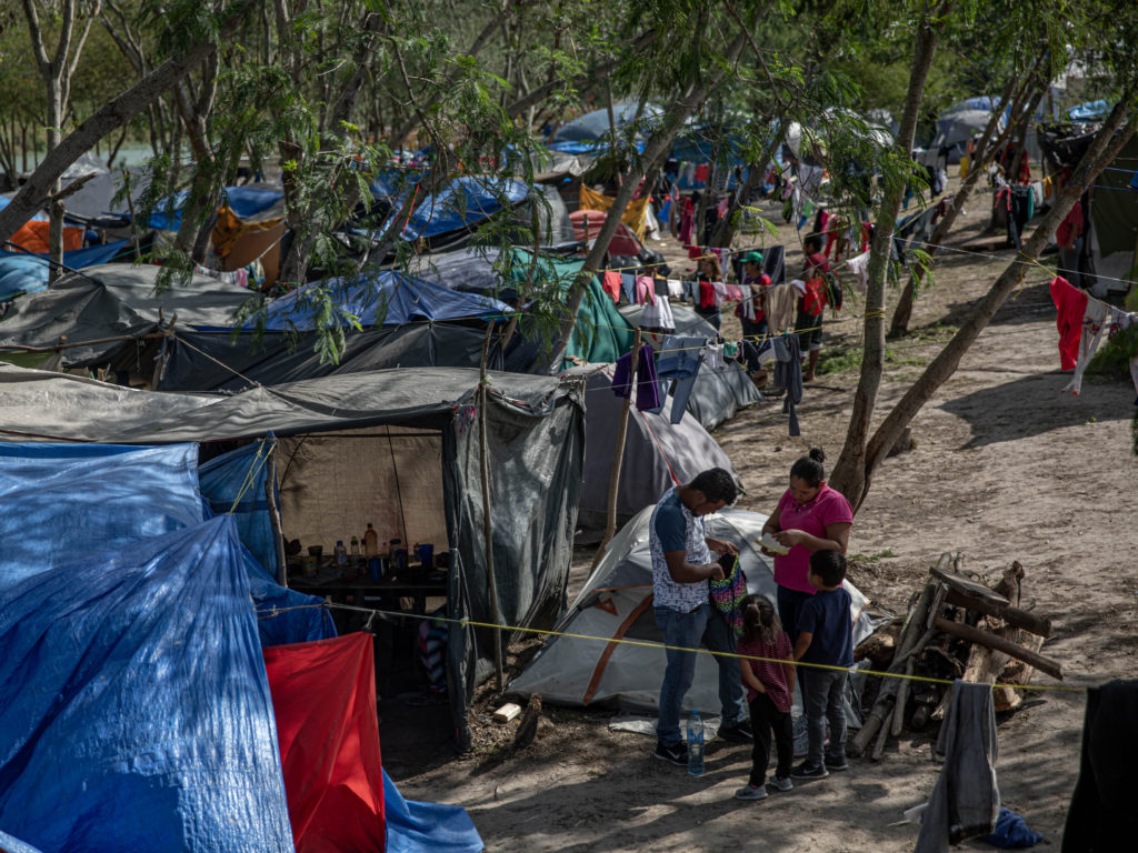 Clothing hangs to dry at a makeshift migrant camp for asylum seekers in Matamoros, Tamaulipas state, Mexico, on earlier this month. About 60,000 migrants live in filthy and dangerous conditions as they await their day in U.S. immigration court. Clothing hangs to dry at a makeshift migrant camp for asylum seekers in Matamoros, Tamaulipas state, Mexico, on earlier this month. About 60,000 migrants live in filthy and dangerous conditions as they await their day in U.S. immigration court. (Alejandro Cegarra/Bloomberg via Getty Images)