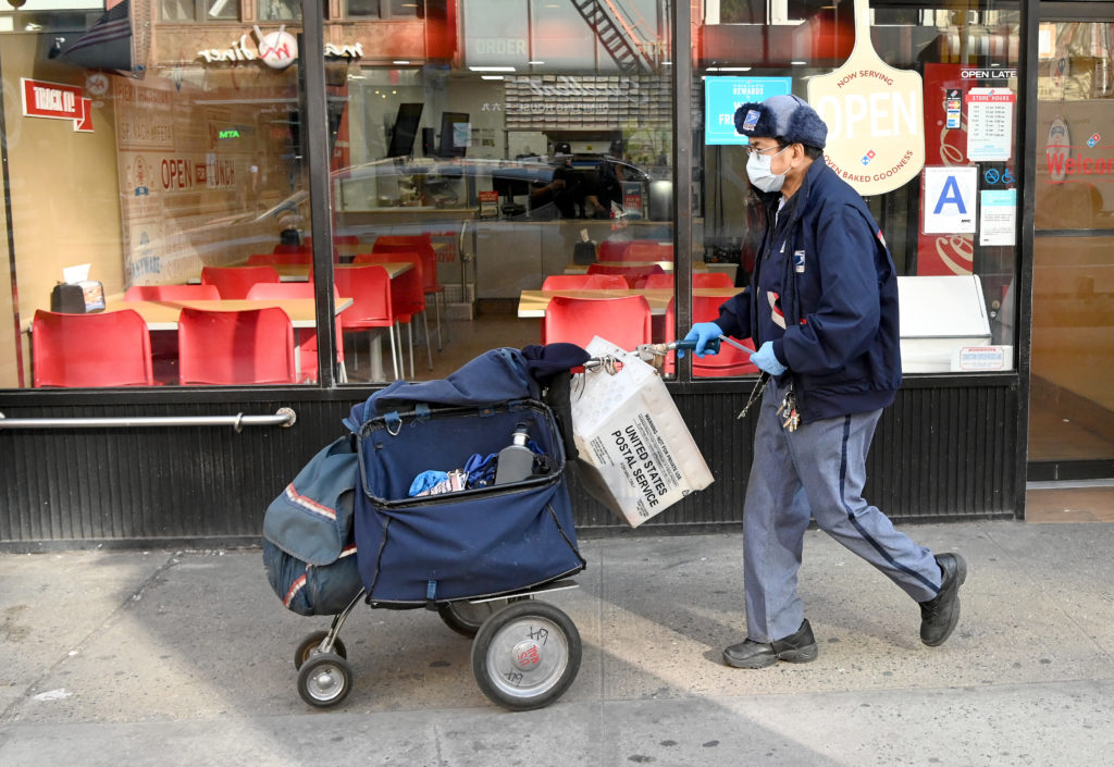 The Postal Service says gloves and surgical masks are made available to all employees who request them, but many postal workers say they don’t have what they need. The Postal Service says gloves and surgical masks are made available to all employees who request them, but many postal workers say they don't have what they need. (Jamie McCarthy/Getty Images)