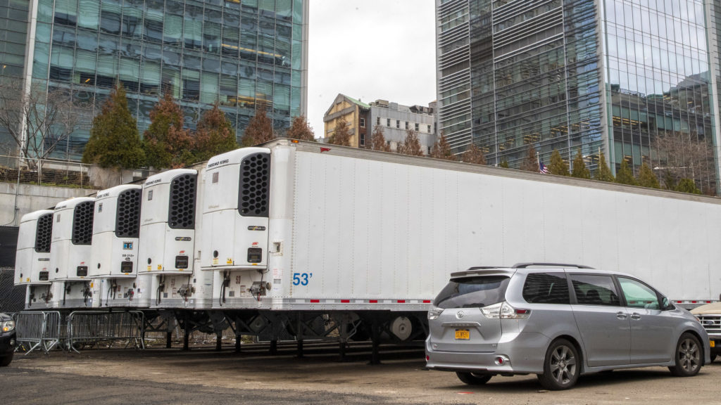 Virus Outbreak New York Refrigerated trailers are seen parked at the site of a makeshift morgue being built in New York, Wednesday, March 25, 2020. (Mary Altaffer/AP Photo)