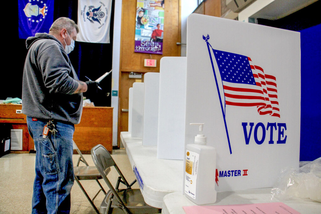 2020 03 17-e lee-bob russikoff-bensalem-state house special election Bob Russikoff wears a mask and gloves to vote in the March 2020 special election for Pennsylvania House of Representatives in Bensalem. (Emma Lee/WHYY)