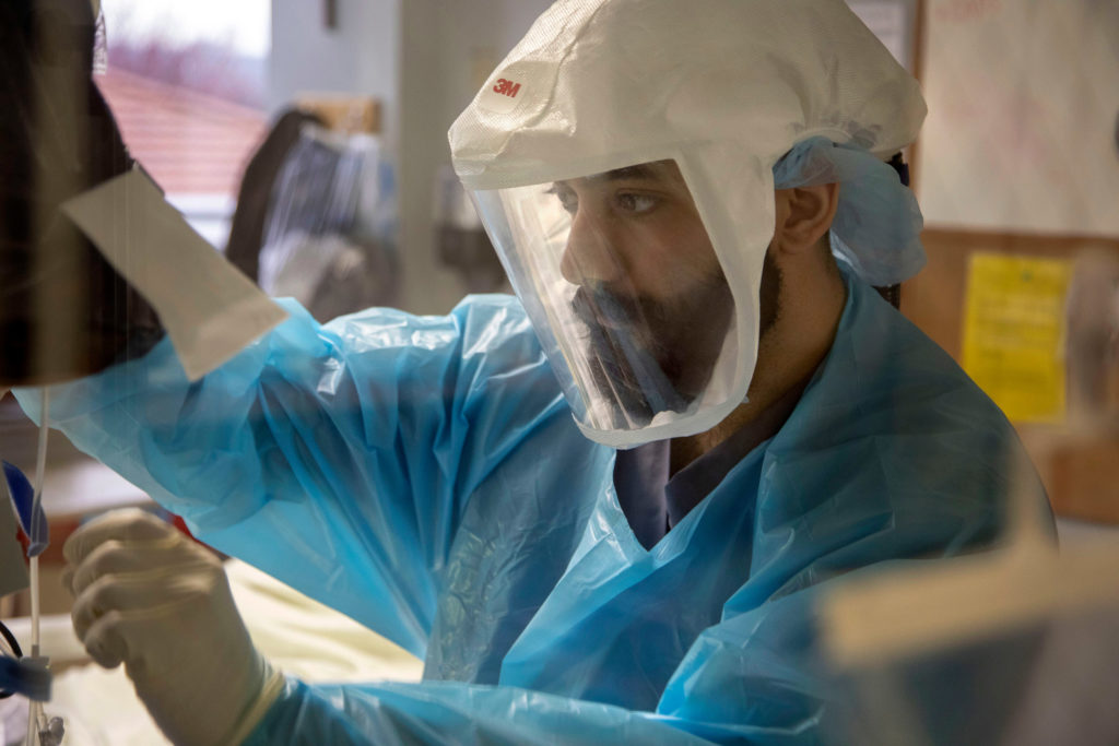 Ranvir Singh, a registered nurse in the  intensive care unit at Holy Name Medical Center in Teaneck, New Jersey, tends to a patient March 19. 2020. (Jeff Rhode/Holy Name Medical Center.)