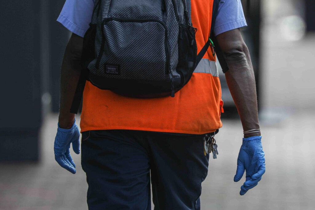 News 2020 – Mar 27 – Residents seen walking down Market Street with protective mask on their faces A man walks on Market Street in Wilmington, Del. wearing protective gloves on Friday, March 27, 2020. (Saquan Stimpson for WHYY)