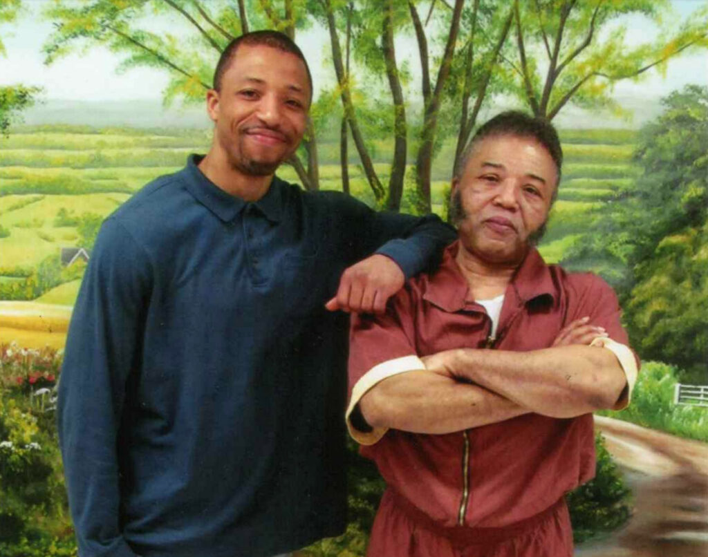 2020 04 23-provided-rudolph sutton and son-prison covid death Rudolph Sutton poses with his son Rudolpho in a photo taken in 2015 at SCI-Graterford in Montgomery County, where Sutton was serving a life sentence. (Courtesy of Rudolpho Sutton)