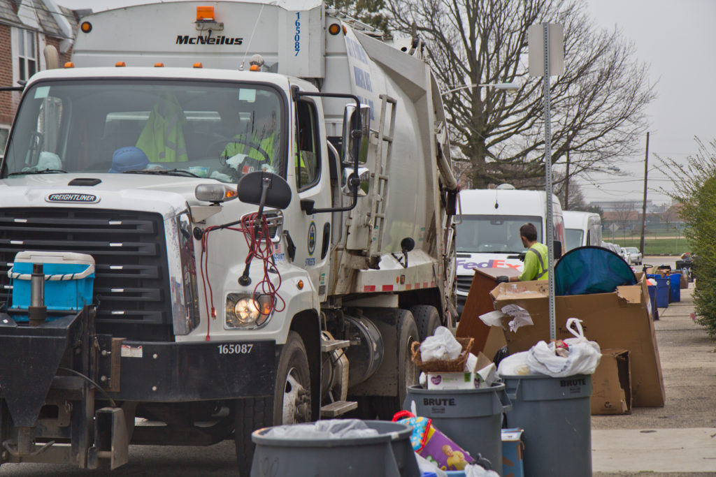 Sanitation workers in Northeast Philadelphia Monday. (Kimberly Paynter/WHYY) File photo: Sanitation workers in Northeast Philadelphia on March 30, 2020. (Kimberly Paynter/WHYY)