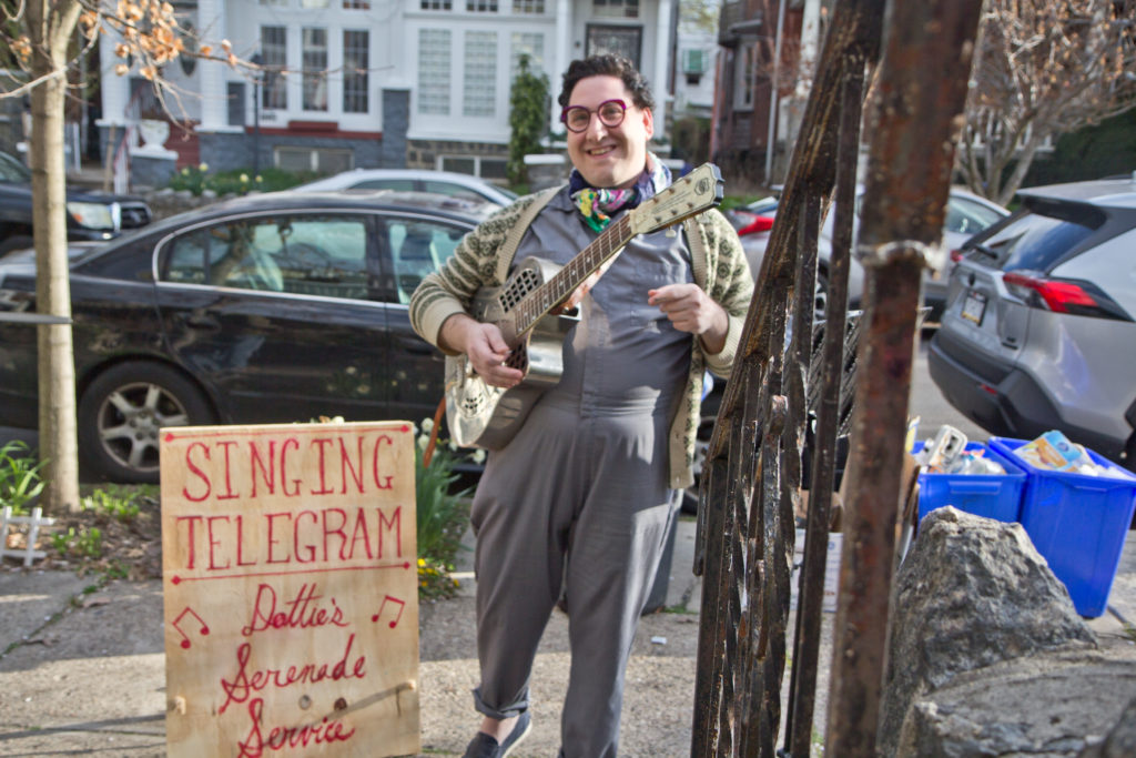 2020 4 6 k paynter dot singing telegram Dottie Levine delivers singing telegrams during coronavirus shutdowns in Philadelphia. (Kimberly Paynter/WHYY)