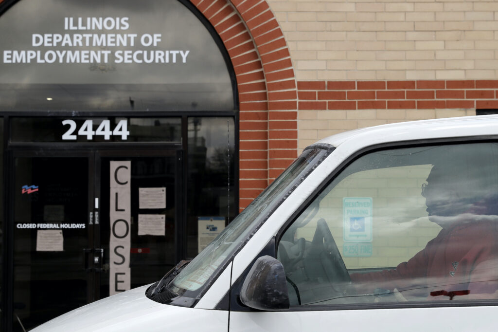 Virus Outbreak Illinois Unemployment A man looks at the closed sign in front of Illinois Department of Employment Security in Chicago, Wednesday, April 15, 2020. More than 500,000 Illinois residents filed unemployment claims in just a five-week span during COVID-19 pandemic. (AP Photo/Nam Y. Huh)