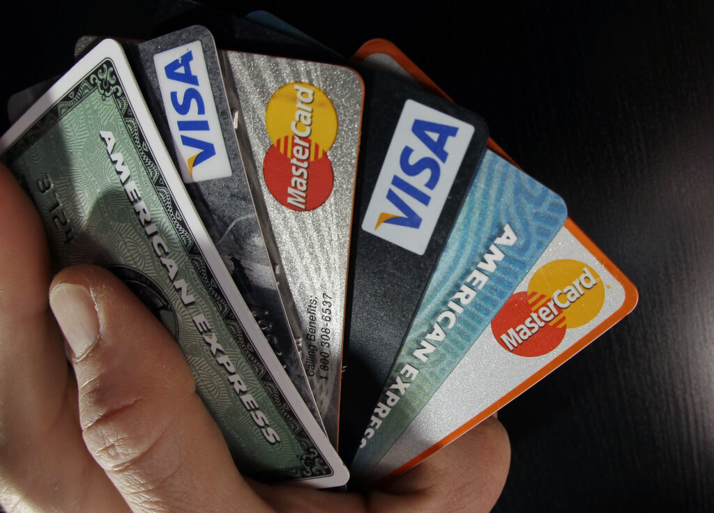 NerdWallet-Payment Accommodations In this March 5, 2012 file photo, consumer credit cards are posed in North Andover, Mass. (Elise Amendola/AP Photo)