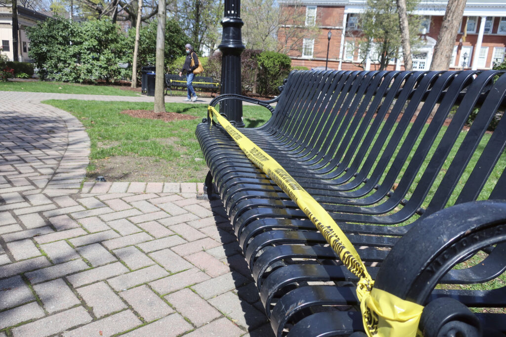 Virus Outbreak New Jersey Police tape covers park benches in Rutherford, New Jersey, to enforce social distancing during the coronavirus pandemic on Sunday, April 19, 2020. (AP Photo/Ted Shaffrey)
