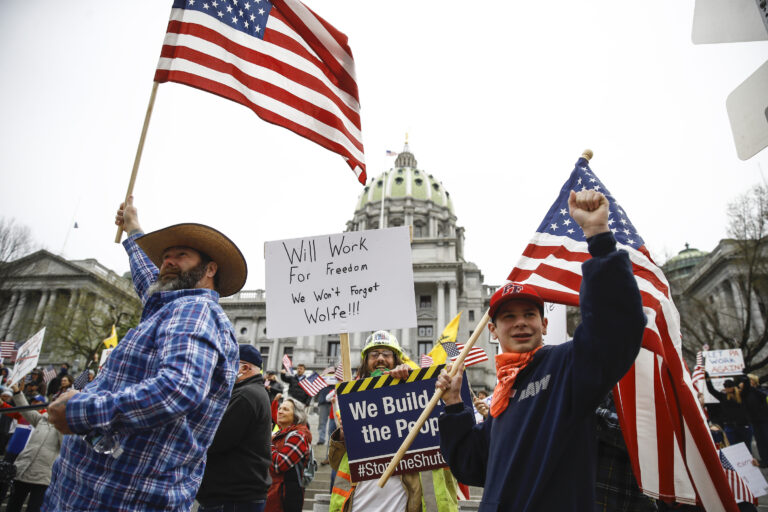 Protesters demonstrate at the state Capitol in Harrisburg, Pa., Monday, April 20, 2020, demanding that Gov. Tom Wolf reopen Pennsylvania's economy even as new social-distancing mandates took effect at stores and other commercial buildings. (AP Photo/Matt Rourke)