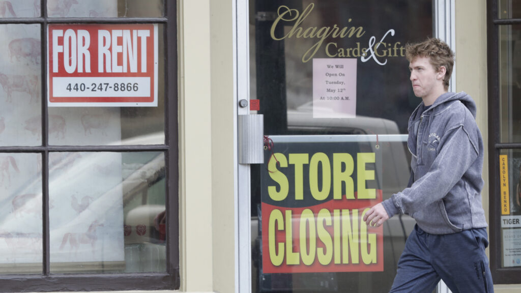Man walks past closed business