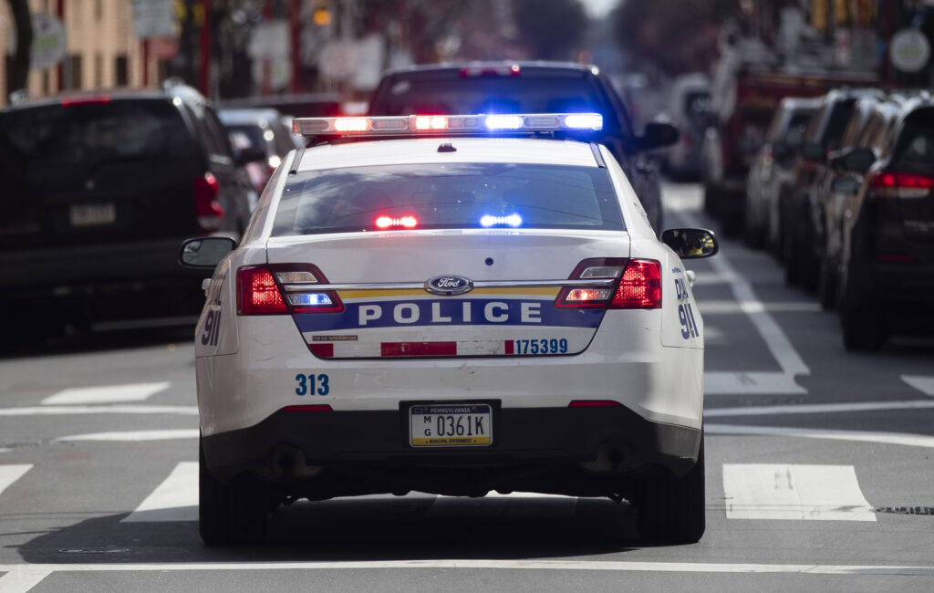 A Philadelphia Police Department cruiser is seen traveling down a Philly street.