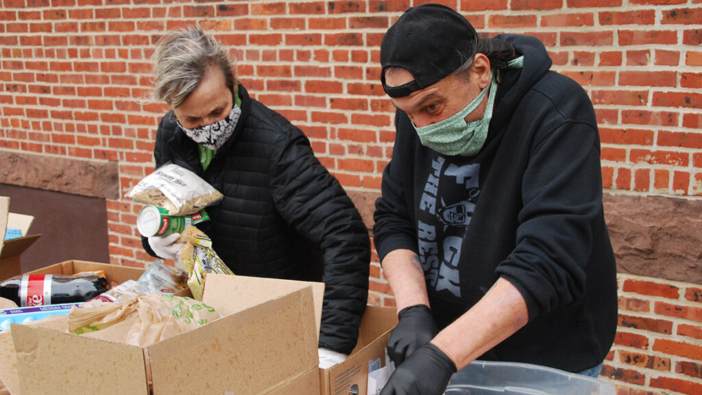 Food-pantry-volunteers-Long-Branch-04.10.20 Volunteers at St. Luke’s United Methodist Church in Long Branch are coping with a sudden surge in demand for food boxes during the COVID-19 crisis. (Jon Hurdle/NJ Spotlight)