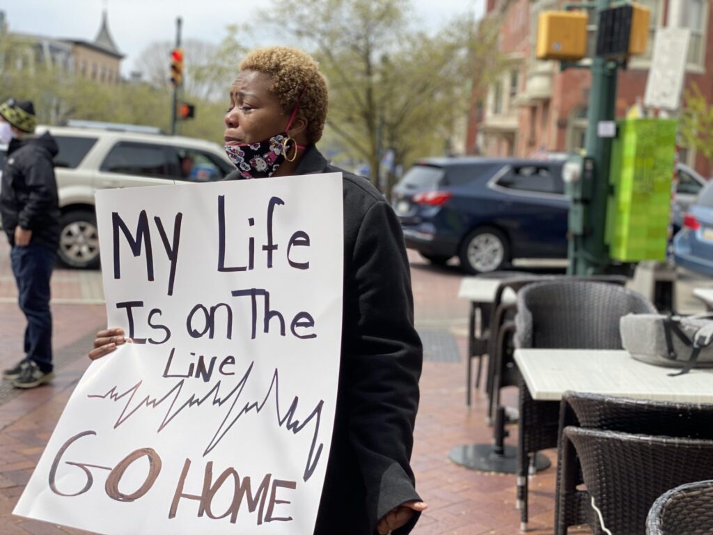 IMG_0802-1920×1440 Yetta Timothy, a certified nursing assistant in Harrisburg, was among a small group of health care workers who showed up to counter-protest the larger April 20, 2020, rally urging the quick reopening of Pennsylvania's economy. (Joseph Jaafari/PA Post)