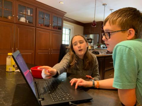 IMG_2023 In the Kauffman household in Radnor, sister Shelby helps out brother Jake with his school work. (Courtesy of Carrie Kauffman)